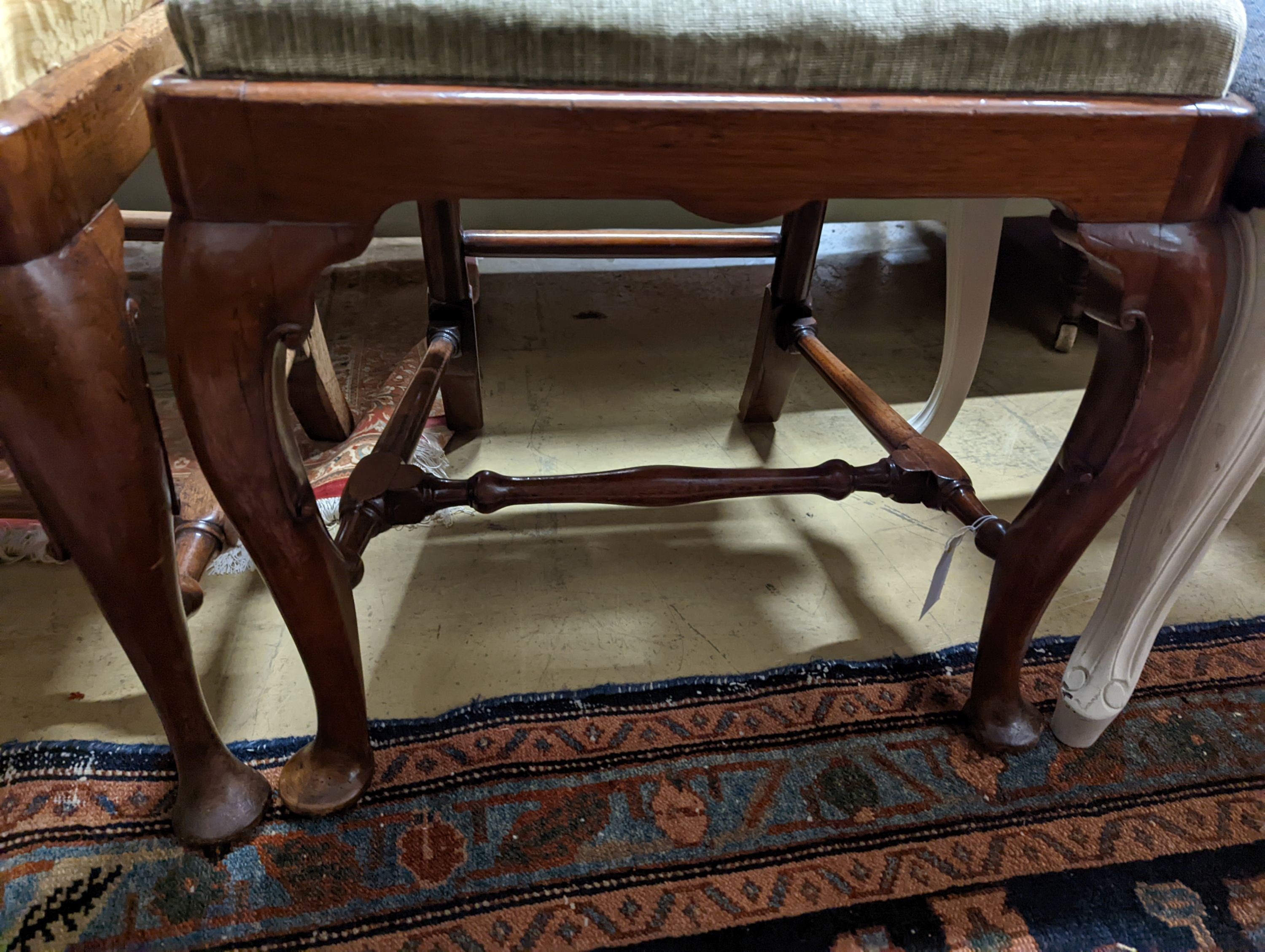 A pair of George II walnut dining chairs